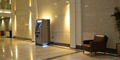 An ATM in a profitable business lobby, a key location for making money with an ATM.