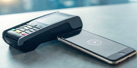 A credit card reader for Android being used to accept a contactless payment.